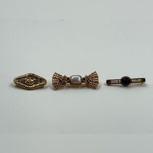 Elegant Gold and Black Brooch Set